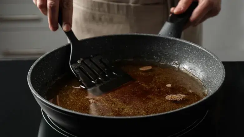 chef-who-is-about-to-place-induction-cookware-properly-over-the-induction-stove